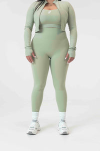 Model wearing S+S high-waist leggings in Sage, size large, showcasing the sculpting fit and glute-shaping seams.